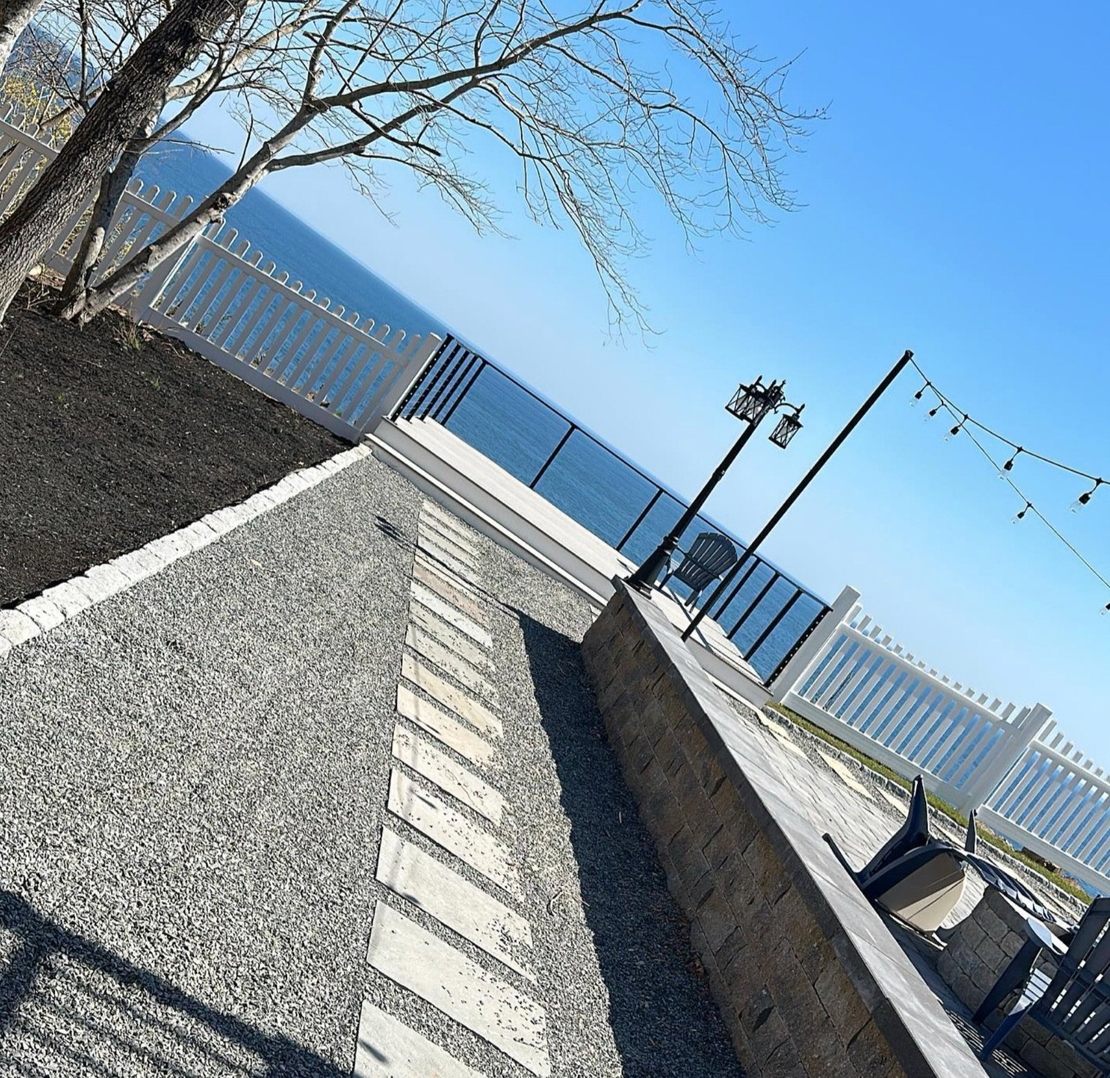 Finished block wall with drainage stone backfilled behind it on a waterfront property