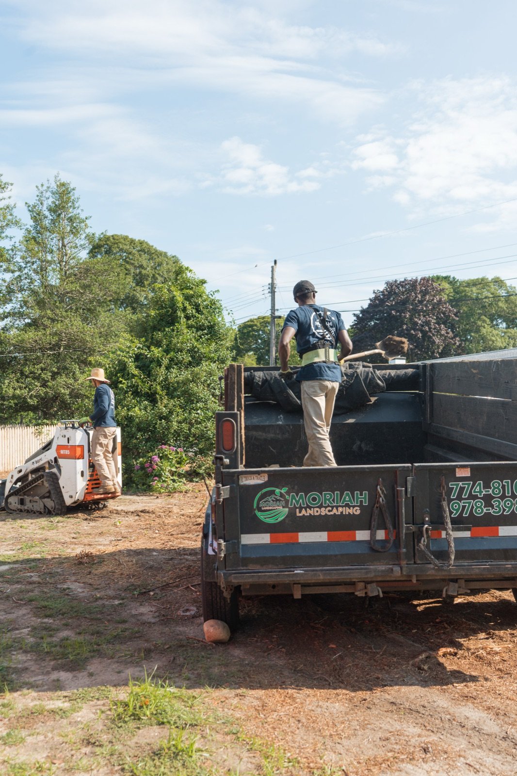 Moriah crew loading a dump truck on a South Yarmouth job site