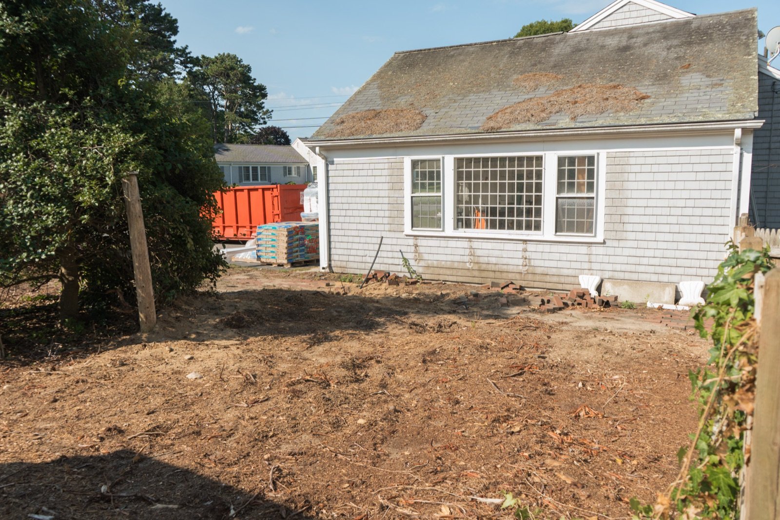 Ground excavated and graded flat, ready for base material before paving begins